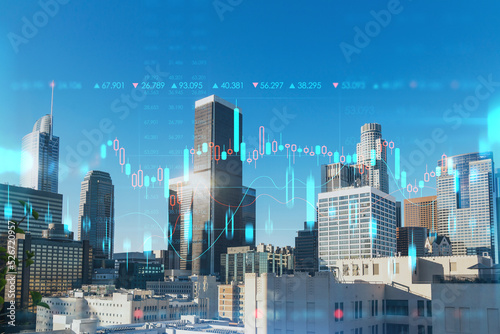Panorama cityscape of Los Angeles downtown at day time, California, USA. Skyscrapers of LA city. Glowing forex graph hologram. The concept of internet trading, brokerage and fundamental analysis