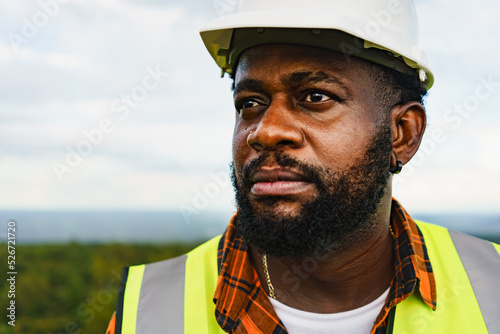 Photos Close up portrait of black engineer man with serious face expression while working outdoor