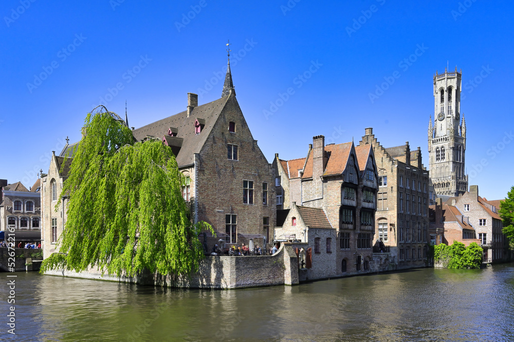 Famous canal of Rozenhoedkaai and the Belfry in the background, Bruges, Belgium