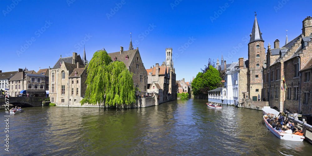 Naklejka premium Famous canal of Rozenhoedkaai and the Belfry in the background, Bruges, Belgium