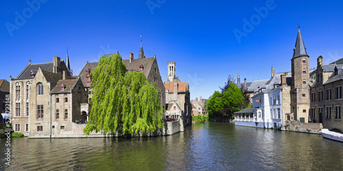 Famous canal of Rozenhoedkaai and the Belfry in the background  Bruges  Belgium