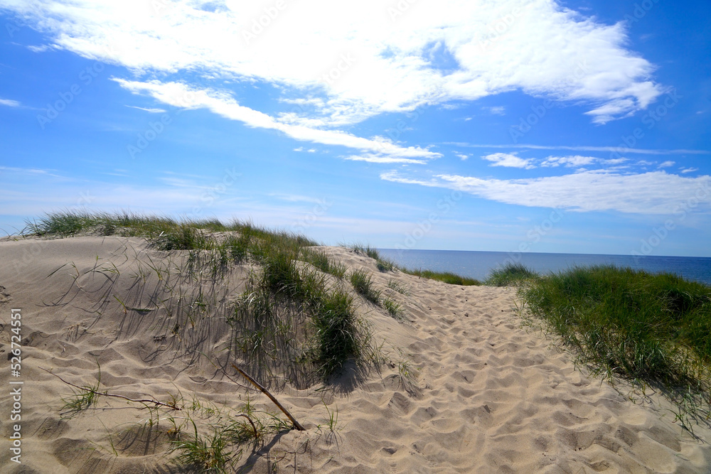 looking across a sandy beach access through the dunes to the blue sea, North Sea, Denmark, high quality picture