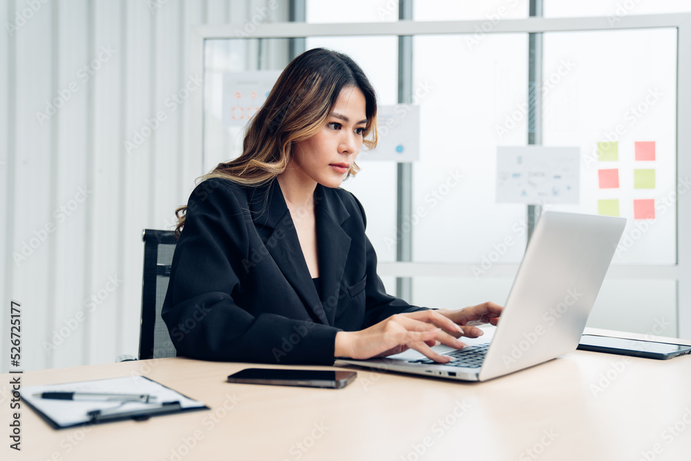 Successful asian businesswoman working at her office desk, Concept of business risk analysis and assessment Successful asian businesswoman working at her office desk, Concept of business risk analysis and assessment