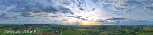 Panorama aerial view of countryside windmills  Agriculture fields and different variety of harvest  View of forest Aerial view of the sky  Panoramic beautiful landscape with sky on a sunny day.