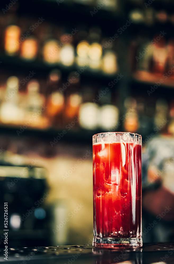Bloody Mary cocktail in glass at the bar counter. Bloody Mary cocktail in glass at the bar counter.