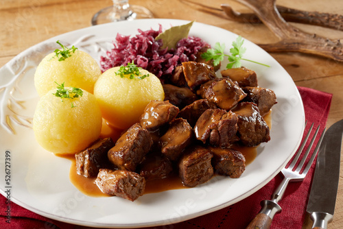 Beef goulash and potato dumplings with sauerkraut