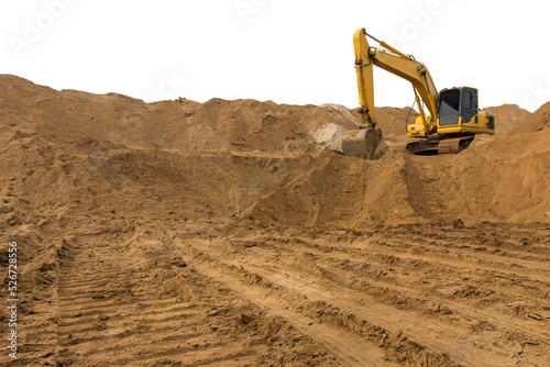 Loader backhoe parked there on the mountain, which has a large pile of sand in the wheel tracks below.