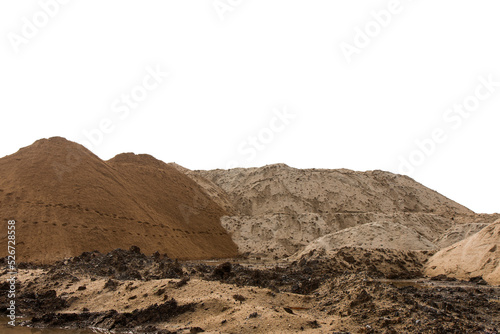 Large piles of sand hills, which traces its feet to walk around the area and a car park with a backhoe.