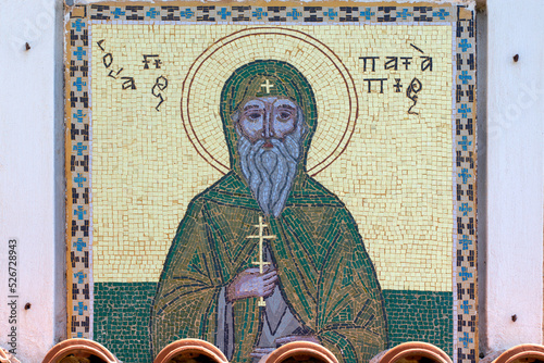 Colourful mosaic hagiography of Saint Patapios ,on the facade above the entrance of the monastery .Loutraki, Corinthia, Peloponnese, Greece