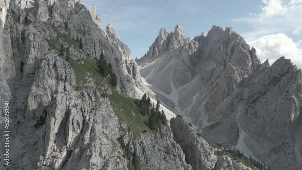 Mountain Crest Aerial Drone with Clouds Video. 4K Mountain Peak Aerial Footage in the Dolomites Italy D-Cinelike Log format Mountain Crest Aerial Drone with Clouds Video. 4K Mountain Peak Aerial Footage in the Dolomites Italy D-Cinelike Log format