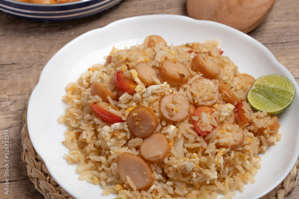 Sausage fried rice with egg and vegetables in white plate Sausage fried rice with egg and vegetables in white plate