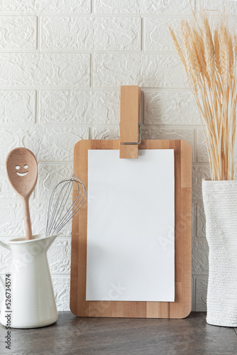 blank for menu or recipe, kitchen background with chud and white sheet on wooden cutting board, free space for text photo