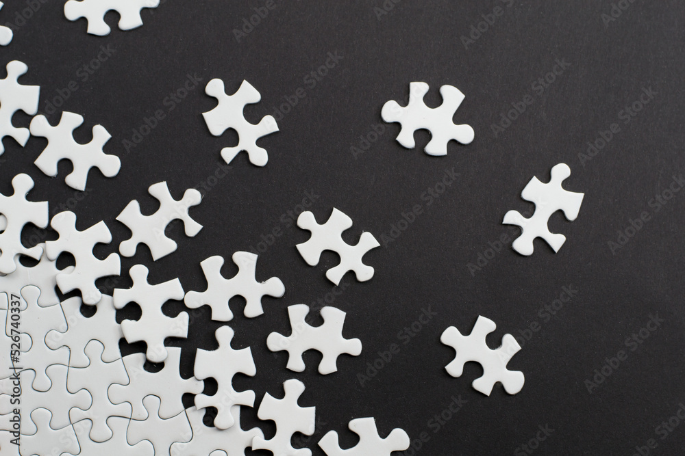 Close-up of blank white jigsaw puzzle texture background Close-up of blank white jigsaw puzzle texture background