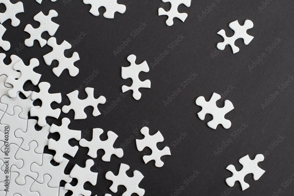Close-up of blank white jigsaw puzzle texture background Close-up of blank white jigsaw puzzle texture background