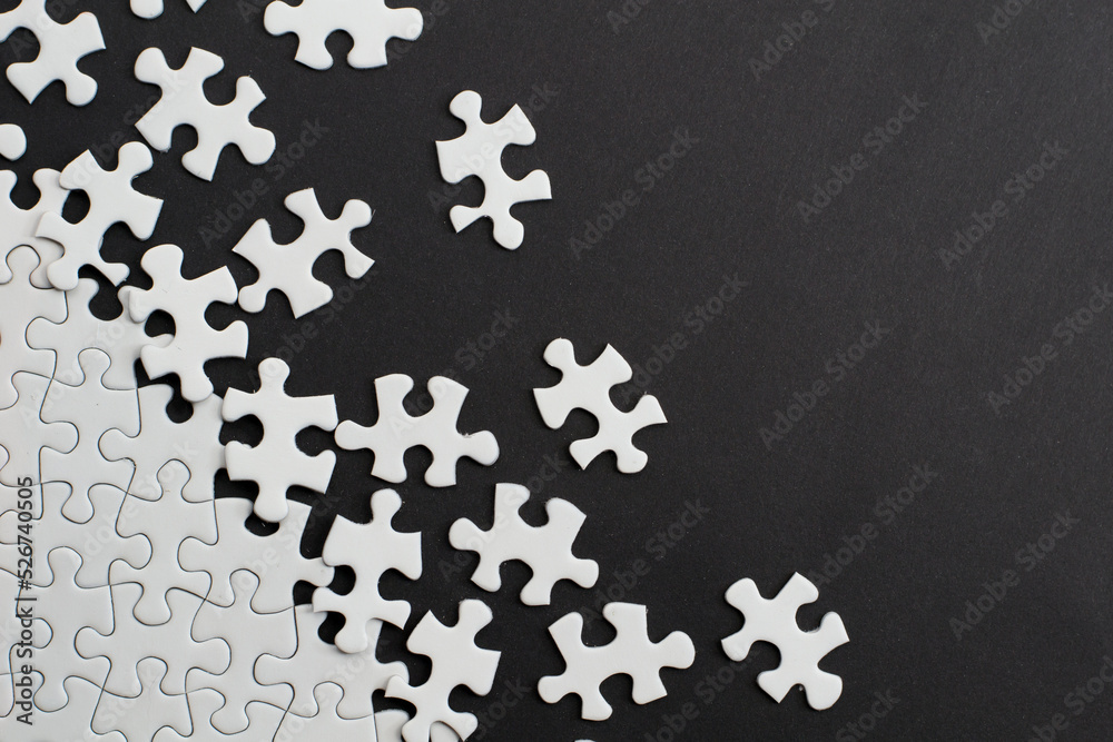 Close-up of blank white jigsaw puzzle texture background Close-up of blank white jigsaw puzzle texture background