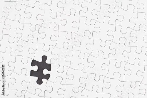 Close-up of blank white jigsaw puzzle texture background