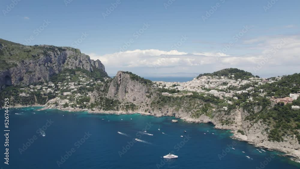 Dramatic terrain and coastline of touristic Capri island, Italy; aerial pan Dramatic terrain and coastline of touristic Capri island, Italy; aerial pan