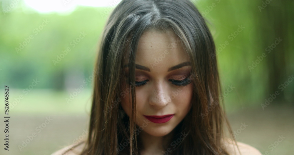 Girl in her 20s taking a deep breath. Young woman breathing the fresh air at park looking to camera feeling refreshed and happy Girl in her 20s taking a deep breath. Young woman breathing the fresh air at park looking to camera feeling refreshed and happy
