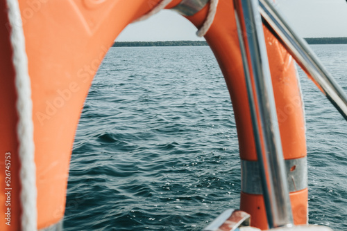 sailing yacht goes on the lake. photo from the yacht. lake and horizon view.