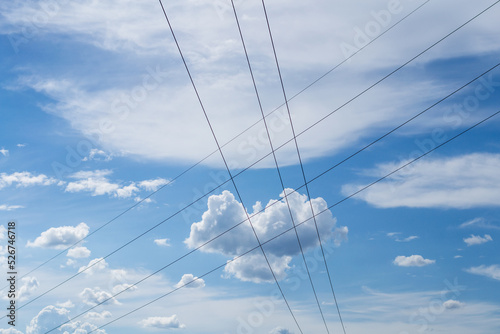 Blue sky and clouds with electric cables.