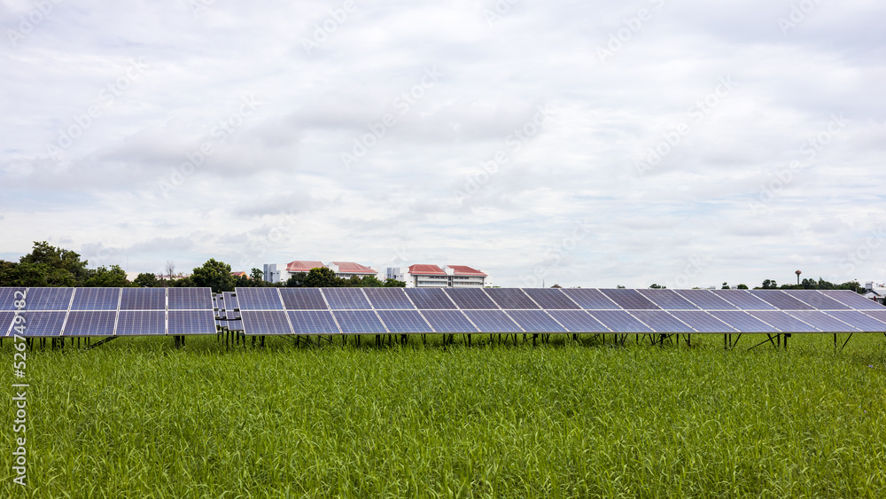 A landscape of solar panels for renewable energy stretches on the ground. A landscape of solar panels for renewable energy stretches on the ground.