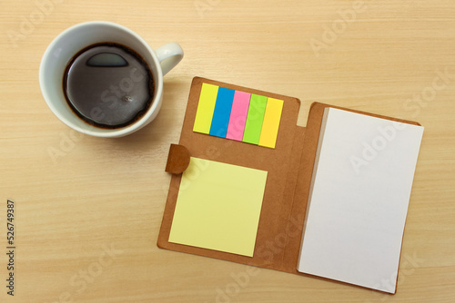 Notepad with cup of coffee