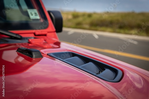 Obraz na plátne Red jeep car on a driveway
