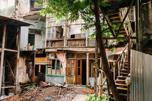 Dilapidated houses, the building is abandoned, destroyed, in the old town of Tbilisi, Georgia. Caucasus. Broken architecture.