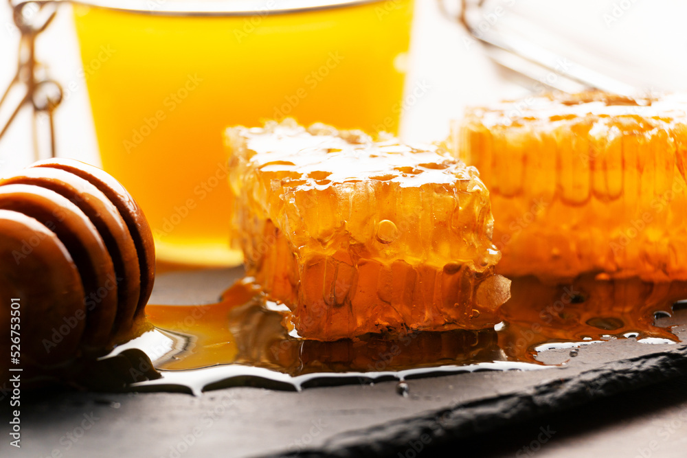 Honeycomb on slate tray on kitchen table macro view Honeycomb on slate tray on kitchen table macro view