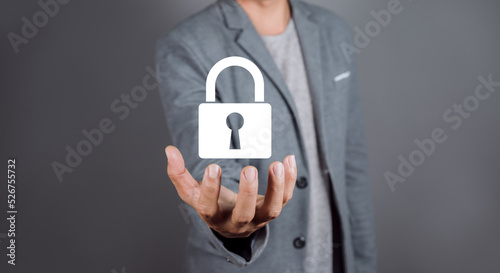 Man hand holding a lock padlock icon. Cyber security network. Data protection privacy concept.