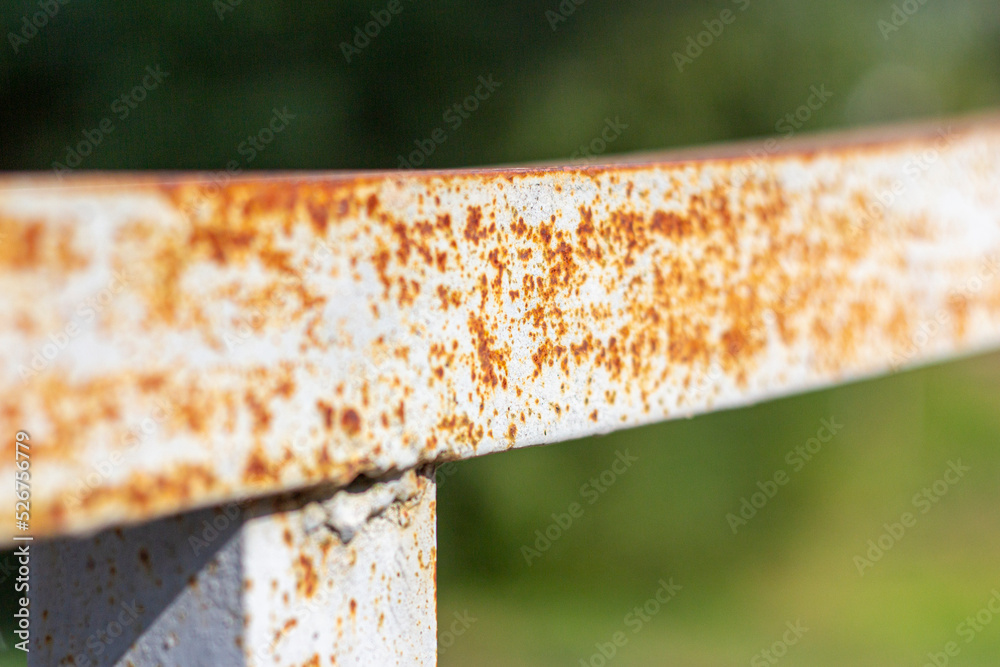 Rust and corrosion on the iron railings of the bridge.Corrosion of metals. Rust on old iron. Rust and corrosion on the iron railings of the bridge.Corrosion of metals. Rust on old iron.