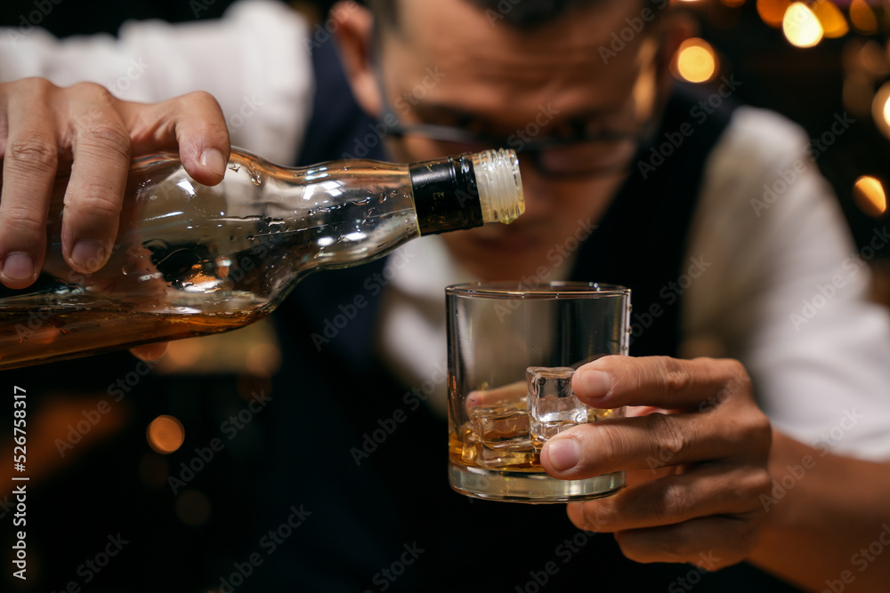 Barman pouring whiskey whiskey glass beautiful night