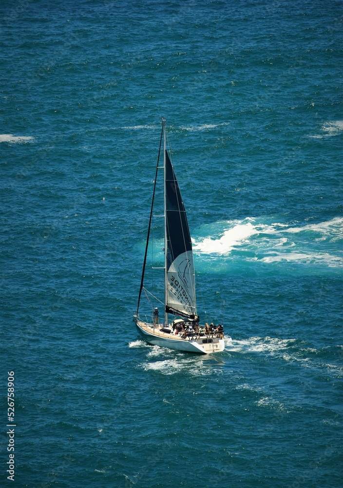Naklejka premium Boat with sail on sea