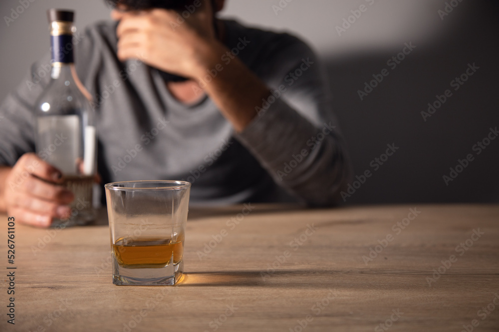 Handsome depressed man drinking whiskey Handsome depressed man drinking whiskey