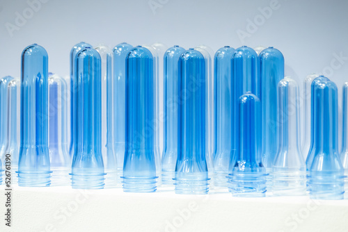 The close up scene of group of preform shape of PET bottle products.