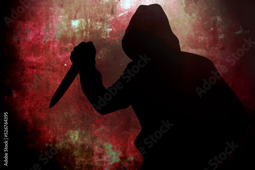 Silhouette criminal holding knife