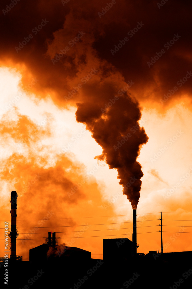 Pollution and smoke from chimneys of factory or power plant environment dirty