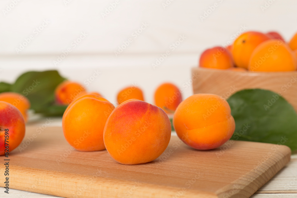 Composition with ripe apricots on wooden background, top view