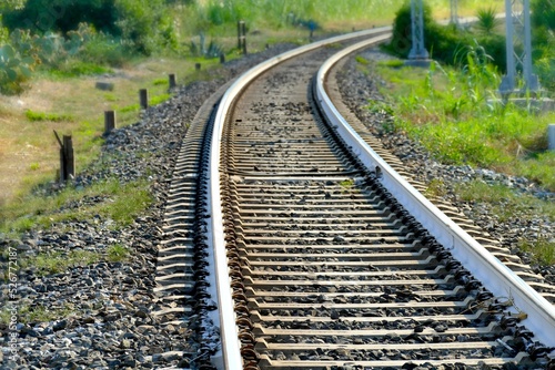 perspective view of railroad tracks narrow focus field on foreground