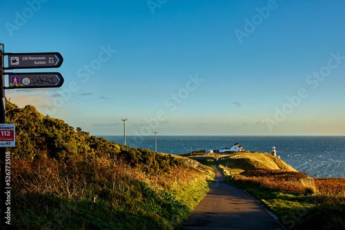 Baily Lighthouse in Howth. Lighthouse on the southeastern part of Howth Head in County Dublin. photo