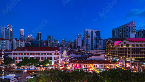 Photography Food stalls at Night Market with skyscrapers at night, Chinatown, Singapore
