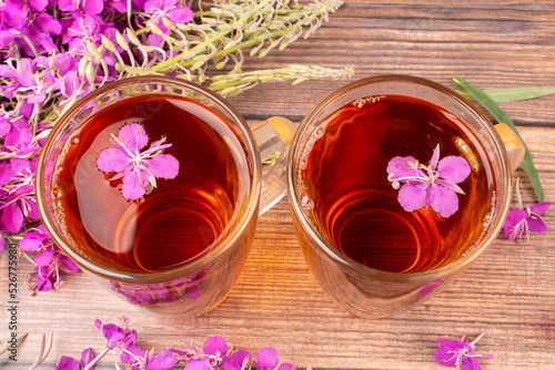 A drink  decoction  from the leaves and flowers of the useful plant ivan-tea  kipreya  epilobium  in two glass mugs. Phytotherapy  herbal treatment.