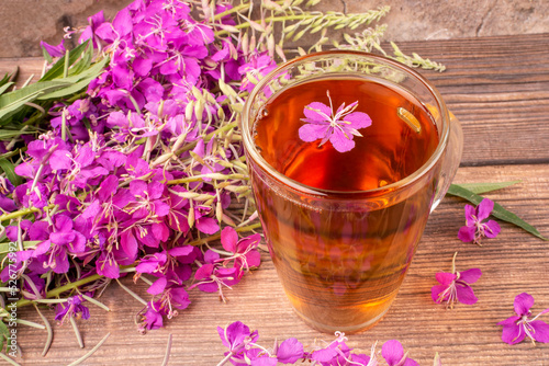 A drink  decoction  from the leaves and flowers of a useful plant of ivan-tea  kipreya  epilobium  in a transparent glass mug. Phytotherapy  herbal treatment.