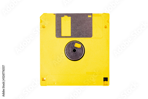 Single yellow floppy drive, old vintage diskette, asset isolated on white background, top view. Save icon concept, obsolete tech, data storing device