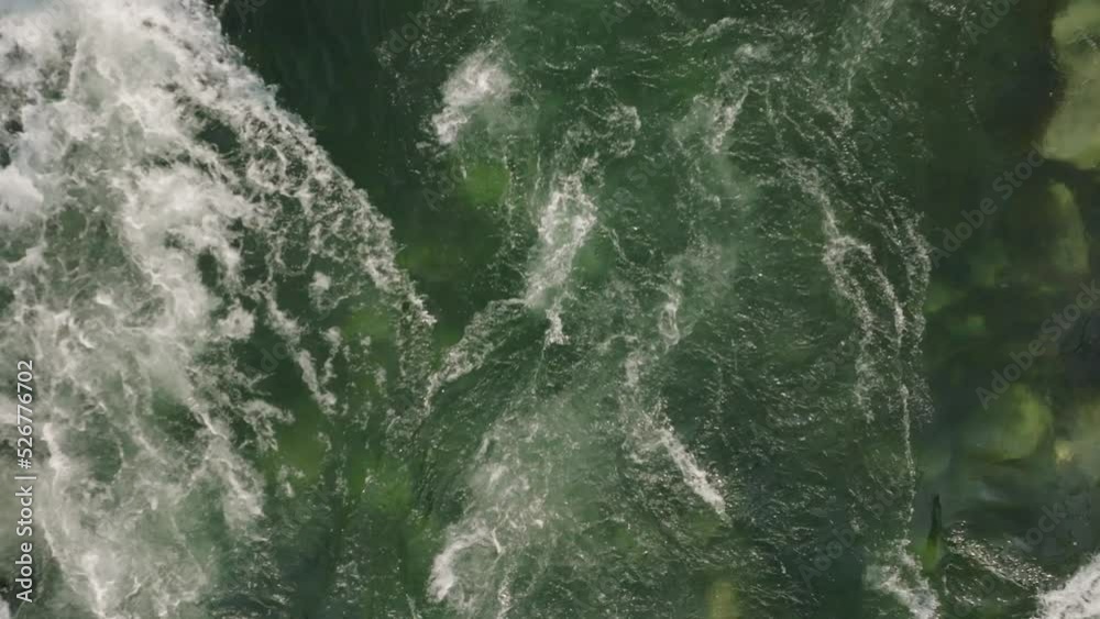 Flying over small rapids in narrow river
