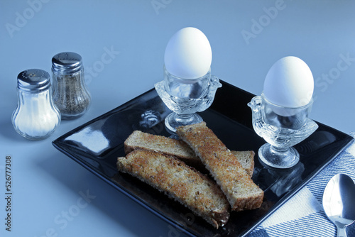 Soft-boiled eggs with toast soldiers for dipping. photo