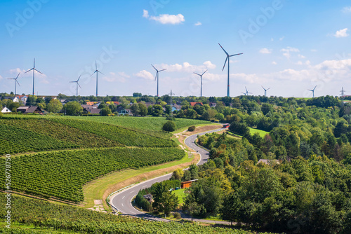 The landscape around Wörrstadt/Germany in Rhineland-Palatinate is characterized by vineyards and wind turbines photo