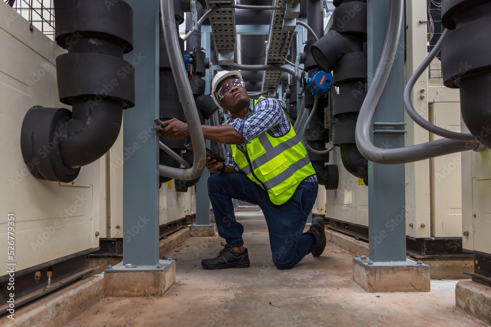 Fototapeta premium Industrial engineer work on site. engineer visit and inspection site engineer at industrial site. Inspector engineer check and working on site 
