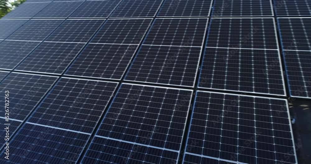 Solar panels and sunlight reflextions on the roof against blue sky background. Concept clean power energy.
Solar panels and sunlight reflextions on the roof against blue sky background. Concept clean power energy.