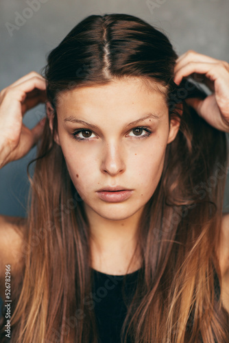 young brunette woman looking in camera